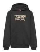 Levi's® Rope Batwing Pullover Hoodie Tops Sweatshirts & Hoodies Hoodies Black Levi's