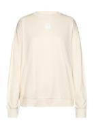 Ovaali Unikko Placement Tops Sweatshirts & Hoodies Sweatshirts Cream Marimekko