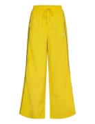 T7 Play.paris. Track Pants Wv Sport Women Sport Clothing Sport Pants Sport Sweatpants Yellow PUMA